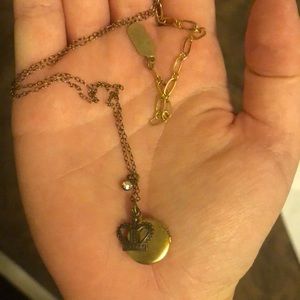 Gold colored locket necklace